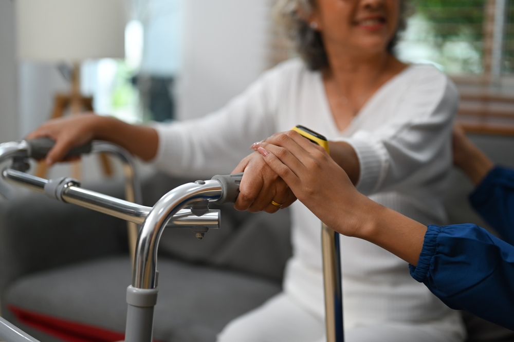 Close,Up,View,Of,Caring,Nurse,Holding,Hands,With,A