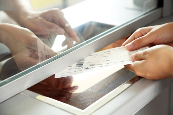 Woman,Buying,Tickets,At,Box,Office