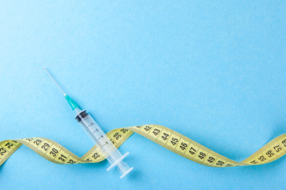 Syringe,With,A,Needle,And,Yellow,Measuring,Tape.,Injections,For